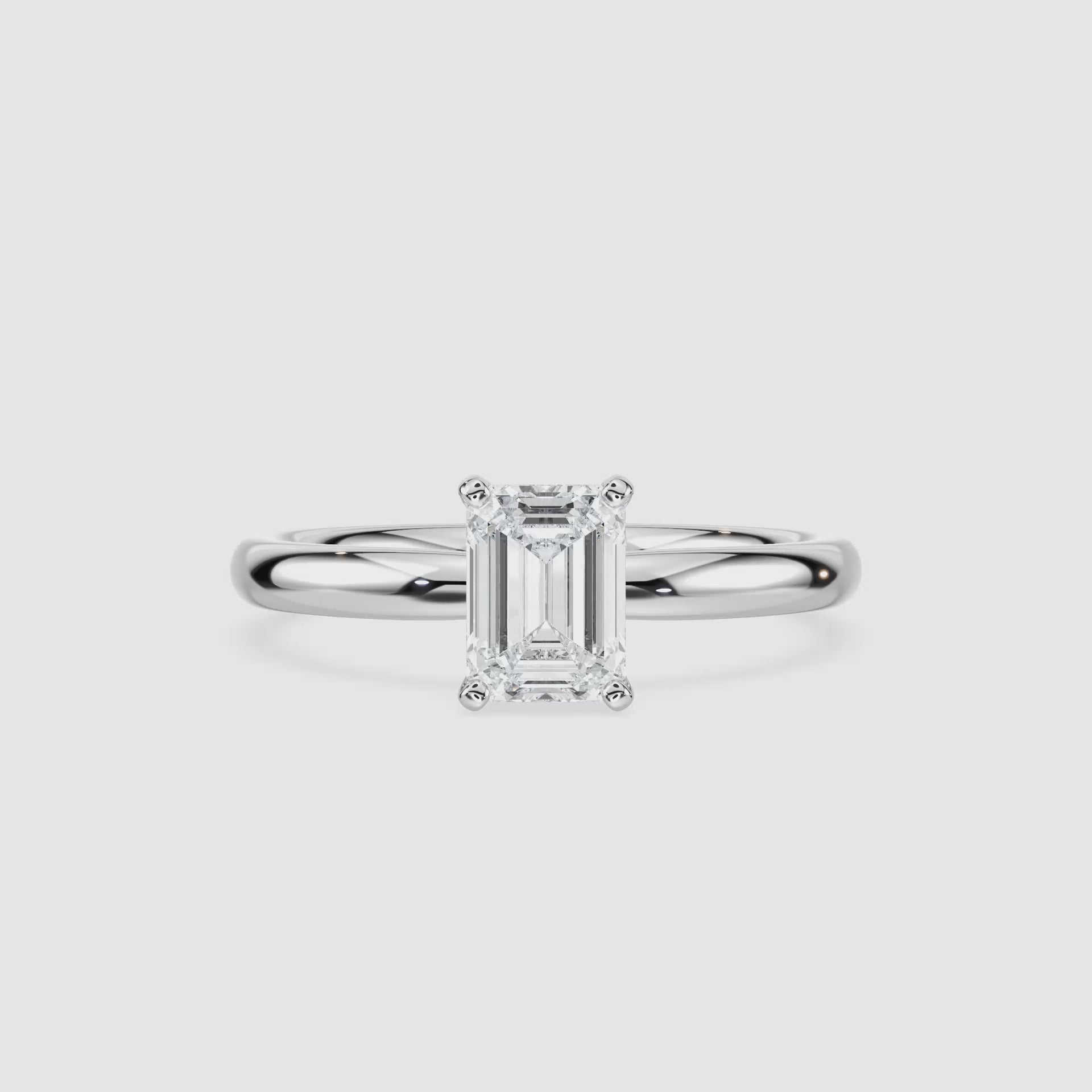 Video laden: Lauren Solitaire Verlobungsring – Smaragdschliff – Weißgold – Video